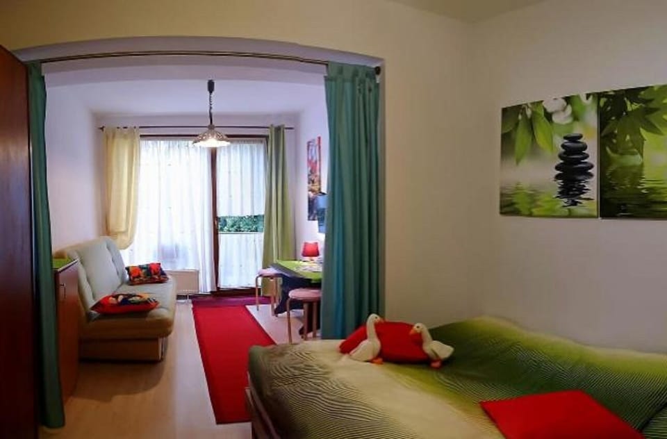 Basic Triple Room | Living room | Flat-screen TV
