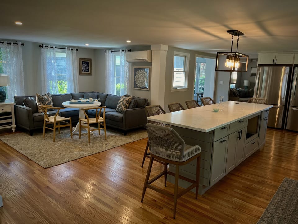 A kitchen that allows for conversation and plenty of places to sit and enjoy 