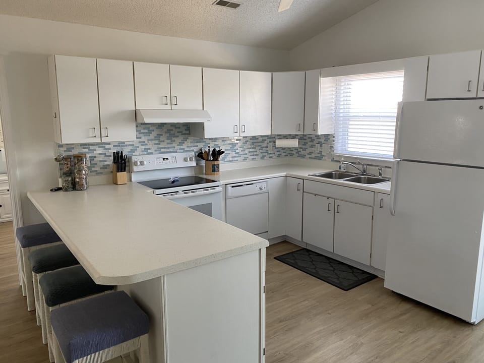 Well stocked kitchen and plenty of room to cook a great meal.