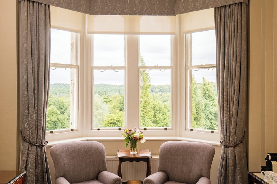 Suite | In-room safe, individually decorated, desk, blackout drapes