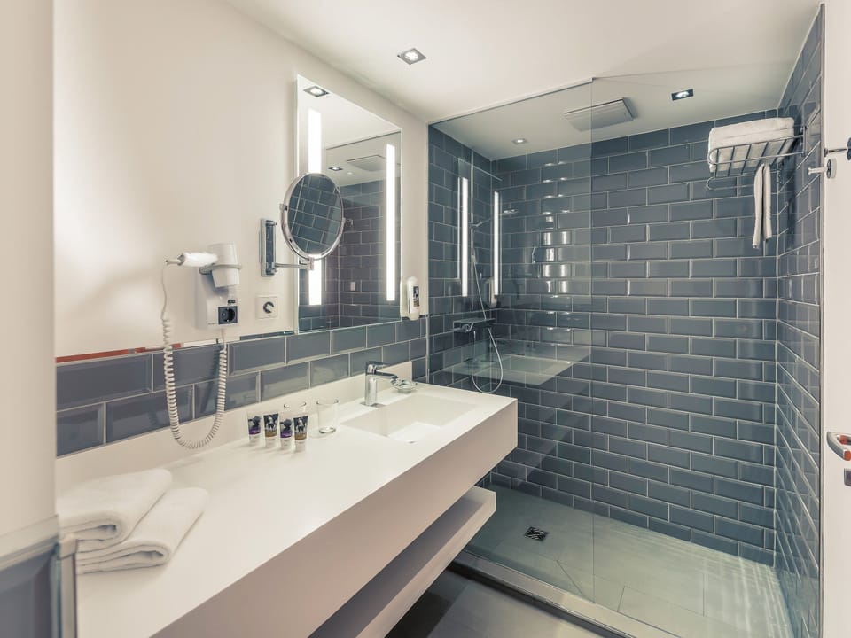 Eco-friendly toiletries, hair dryer, towels