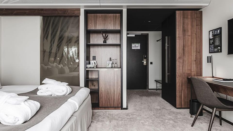 Deluxe Room, 1 King Bed, Non Smoking | Desk, laptop workspace, iron/ironing board, bed sheets