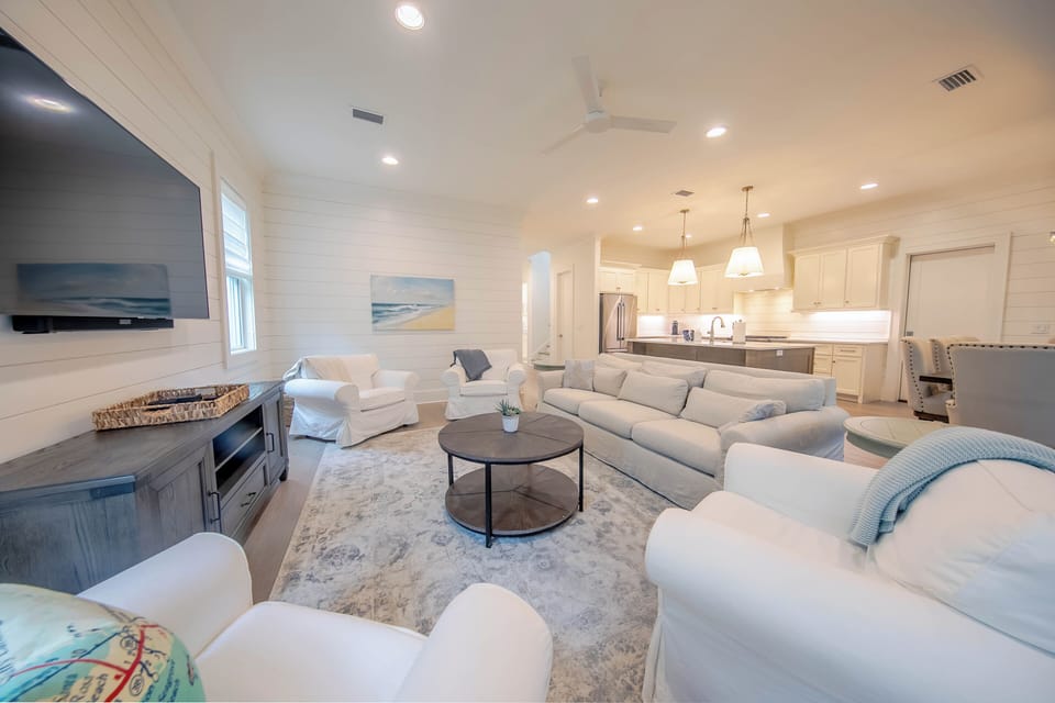 Spacious main floor living room with plenty of seating and smart tv- You Tube TV