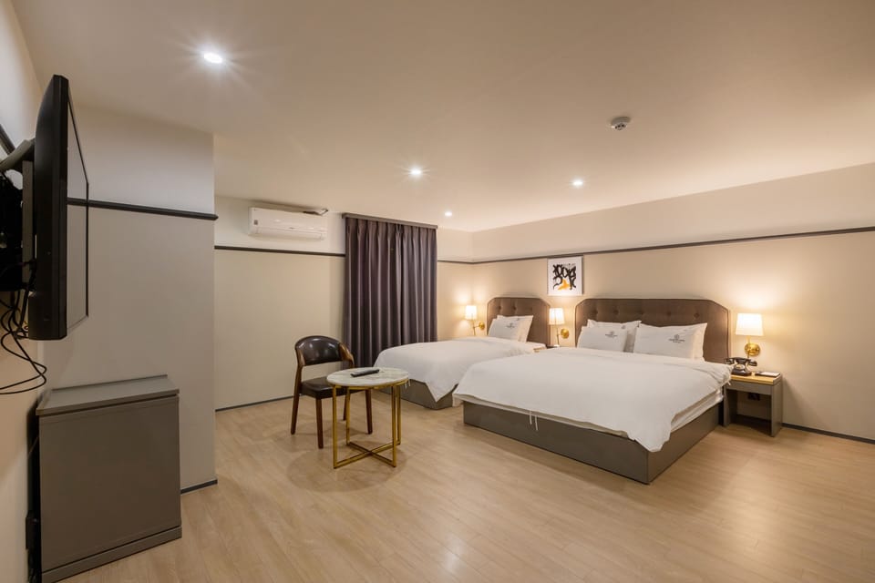 VIP Twin | Premium bedding, individually decorated, desk, laptop workspace