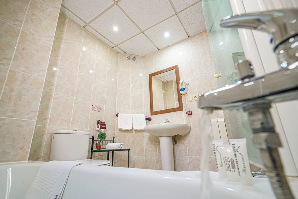 Basic Double Room, 2 Twin Beds | Bathroom amenities | Free toiletries, hair dryer, towels, soap