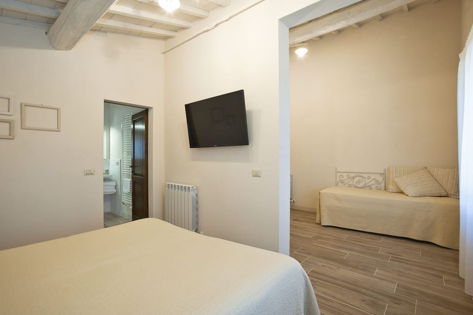 Standard Triple Room, Multiple Beds, Private Bathroom, Hill View | Desk, bed sheets