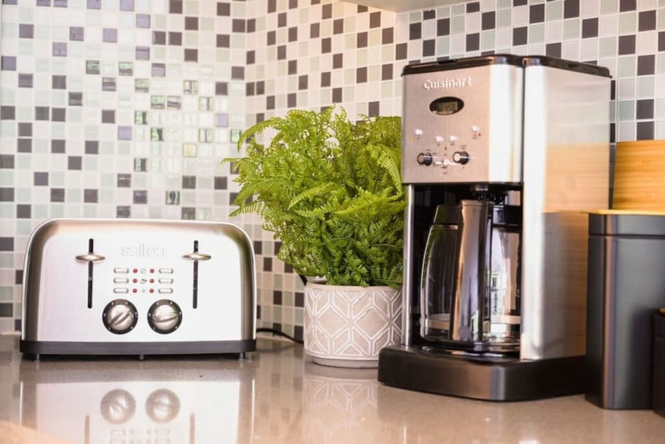 A fully equipped kitchen with small appliances (like this coffee maker & toaster) are a great way to add convenience to your morning rush out the door.
