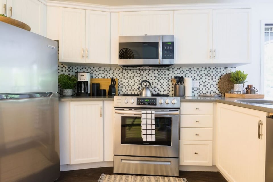 A lovely kitchen that is fully stocked for your stay. Cook a meal with fresh, local ingredients and stay in!