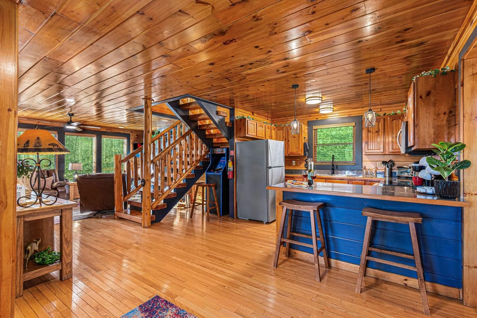 View from the front door of the kitchen, stairs and living room