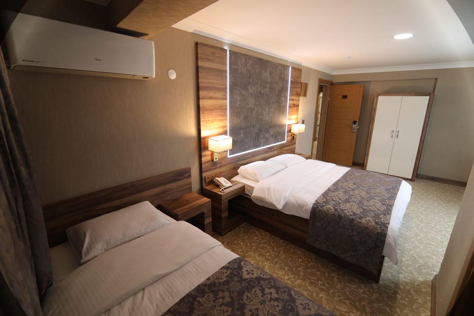Family Triple Room | Premium bedding, down comforters, Select Comfort beds, minibar