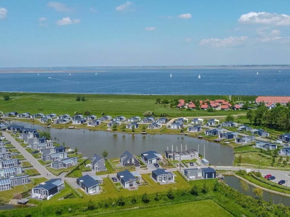 Sky, Cloud, Water, Infrastructure, Land Lot, Urban Design, Grass, Leisure, Landscape, City