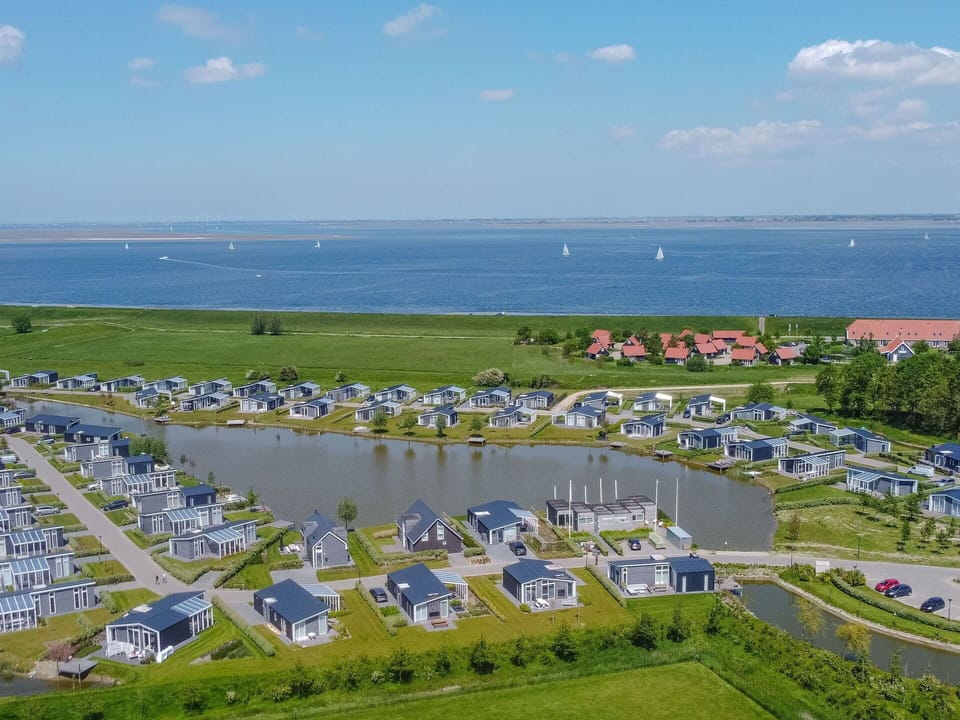 Sky, Cloud, Water, Infrastructure, Land Lot, Urban Design, Grass, Leisure, Landscape, City