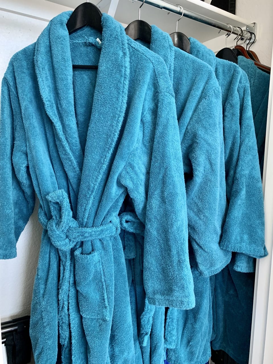 Spa robes in the closet.