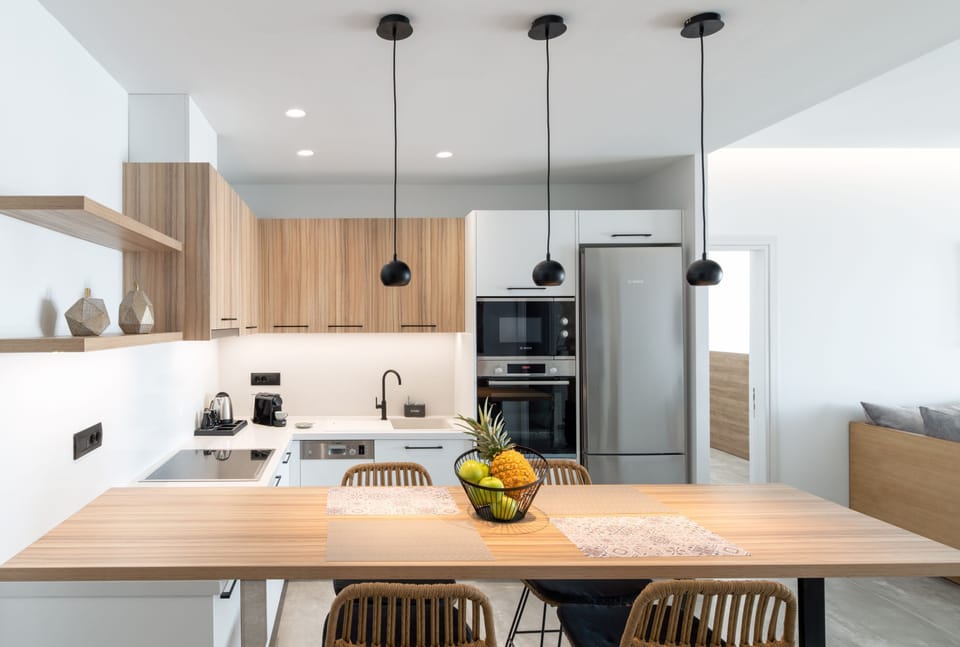 Fully equipped kitchen with indoor dining area.