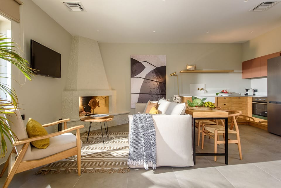 Superior Villa, 3 Bedrooms, Sea View, Mezzanine | Living room | 42-inch Smart TV with cable channels, TV, fireplace