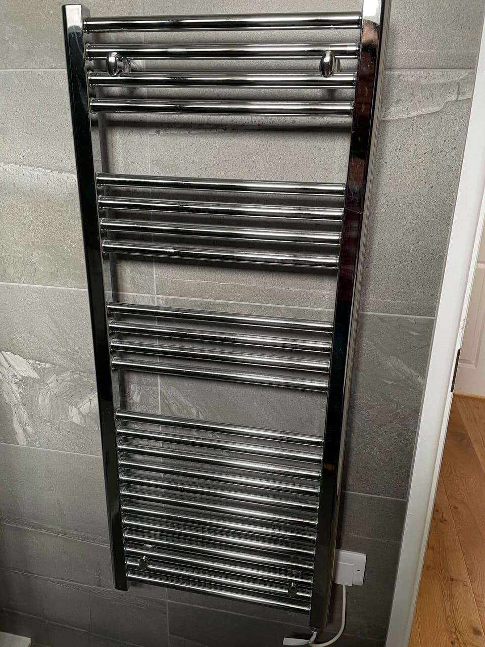 Heated towel rails and underfloor heating  in bathrooms 