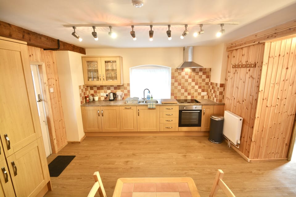 Spacious, fully equipped kitchen for relaxed family meals together.