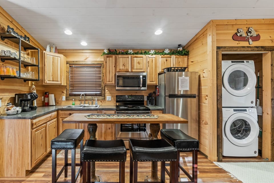 Private kitchen with washer and dryer