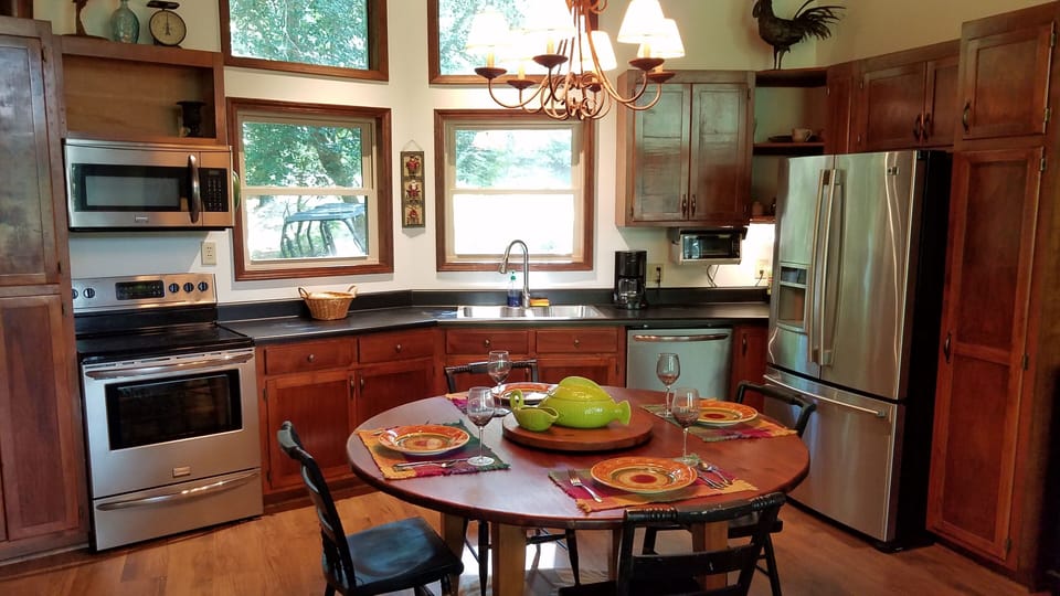 60" Dining table seats six comfortably, but can handle eight in a pinch