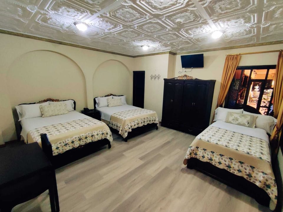 Standard Triple Room | Down comforters, in-room safe, desk, blackout drapes