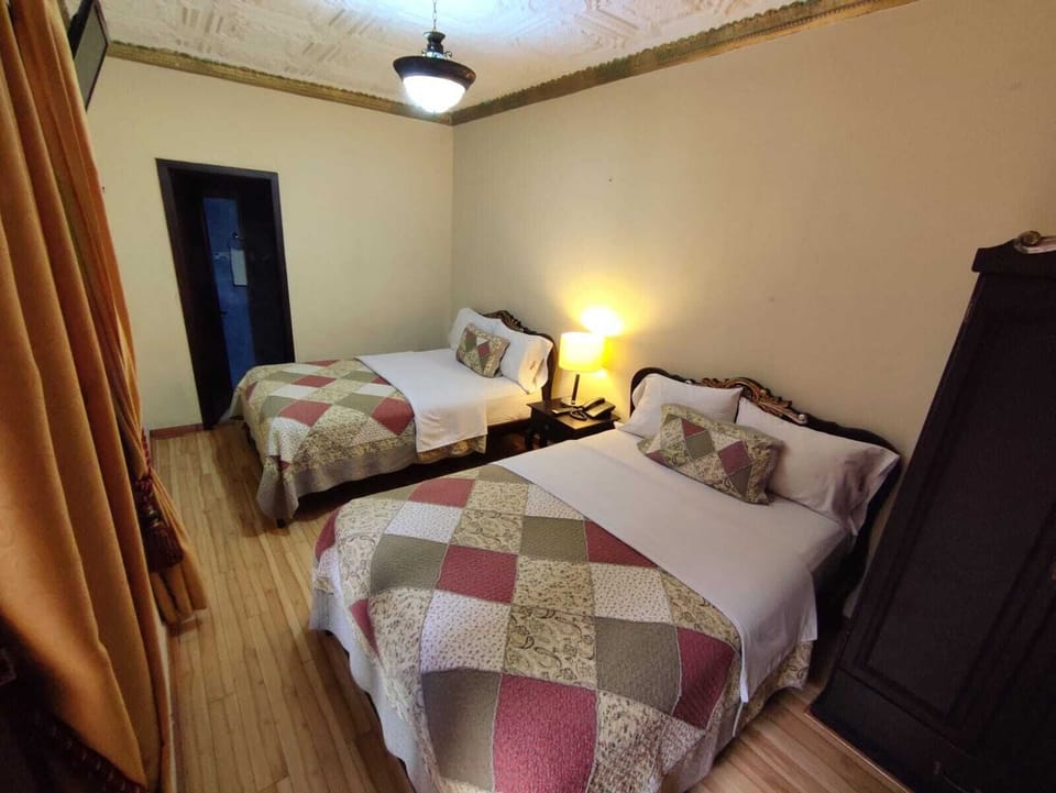 Standard Room, 2 Double Beds | Down comforters, in-room safe, desk, blackout drapes