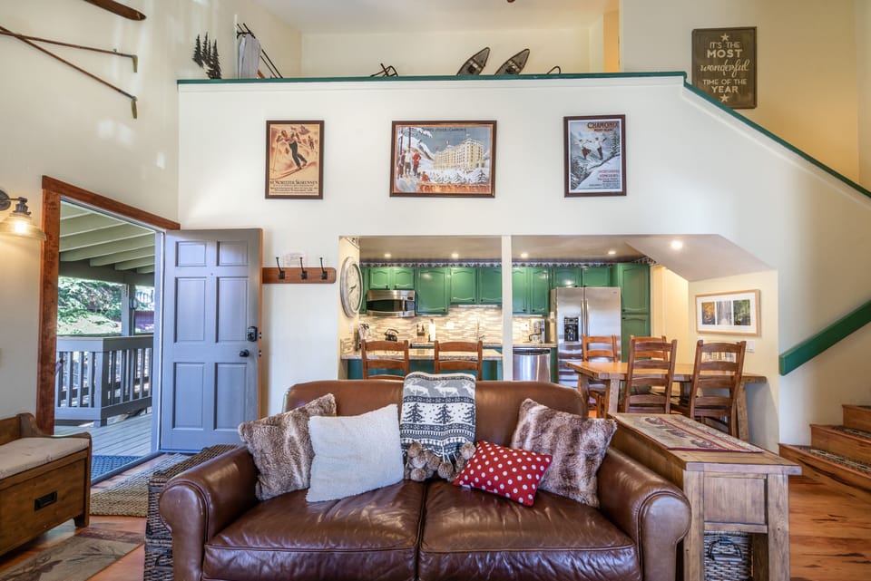 Leather sleeper sofa, and view to Loft Bedroom