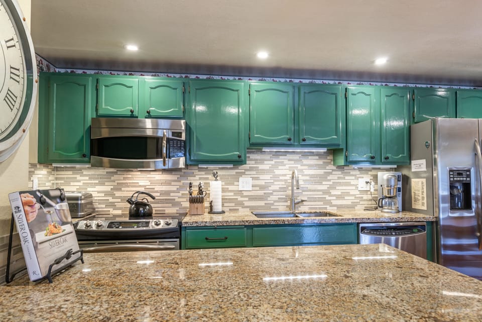 Kitchen with Italian Parsa granite countertop and Marble backsplash - bar area