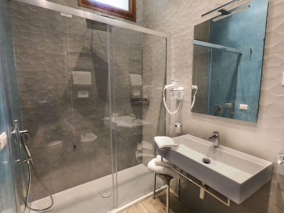 Standard Double Room, Patio, Garden Area | Bathroom | Shower, rainfall showerhead, free toiletries, hair dryer