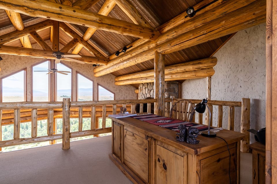 There is a lofted office located up a spiral staircase off of the main level living room. There is a private deck located off of the office.