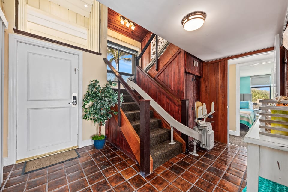 Stair lift provides access to the upper floor for mobility-challenged persons