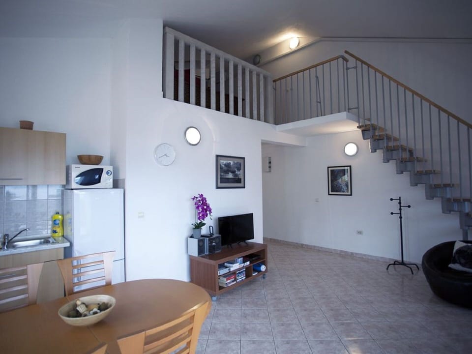 Living area with air con. Second air con upstairs also.
