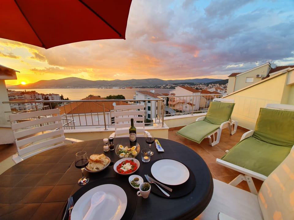 Sun loungers and beds on terrace