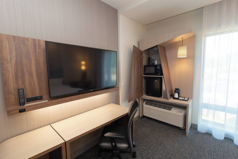 Desk, laptop workspace, blackout drapes, iron/ironing board