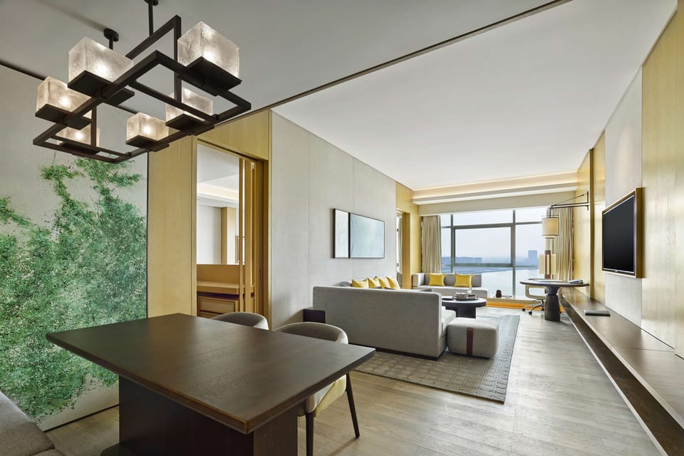 Deluxe Suite, 1 King Bed, Lake View | Down comforters, in-room safe, desk, laptop workspace
