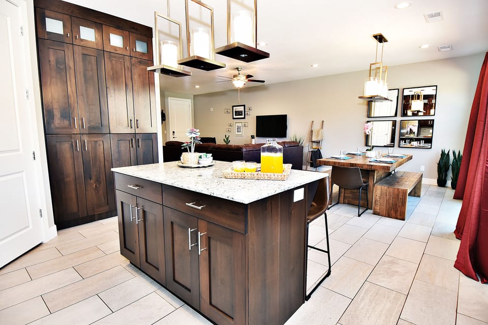 Ent 425 Pristine Clean and Fully Equipped Kitchen with an Island Top Counter and a view of the Spacious Family and Dining Area