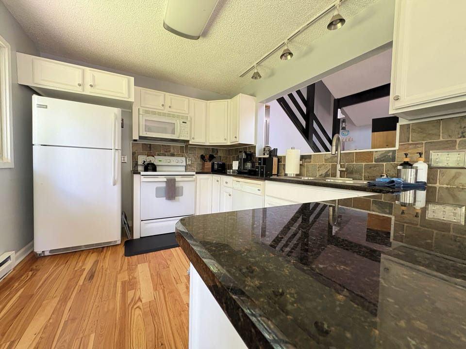 The kitchen layout. Main essentials supplied for your stay.