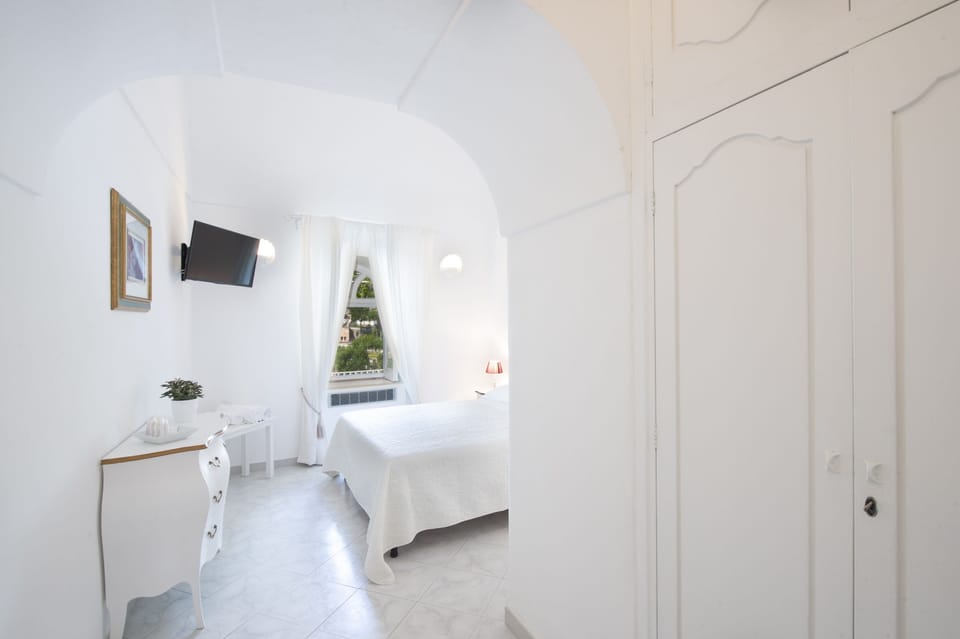 Triple Room, Connecting Rooms, Sea View | Minibar, free WiFi, bed sheets