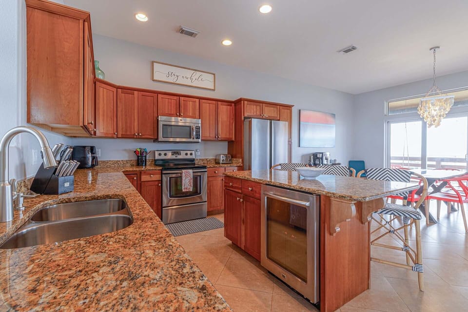 The massive kitchen is the heart of the house and beckons you to upscale entertaining, with stainless steel appliances, granite countertops and a fully-loaded kitchen experience: