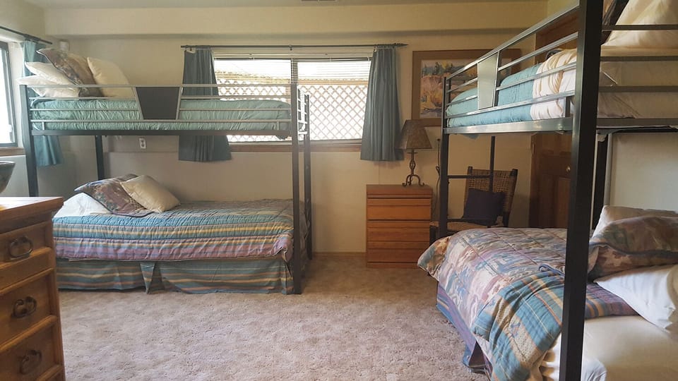 Bedroom #5: Bunkroom sleeps 4 guest in 2 sets of bunkbeds. TV and full bath