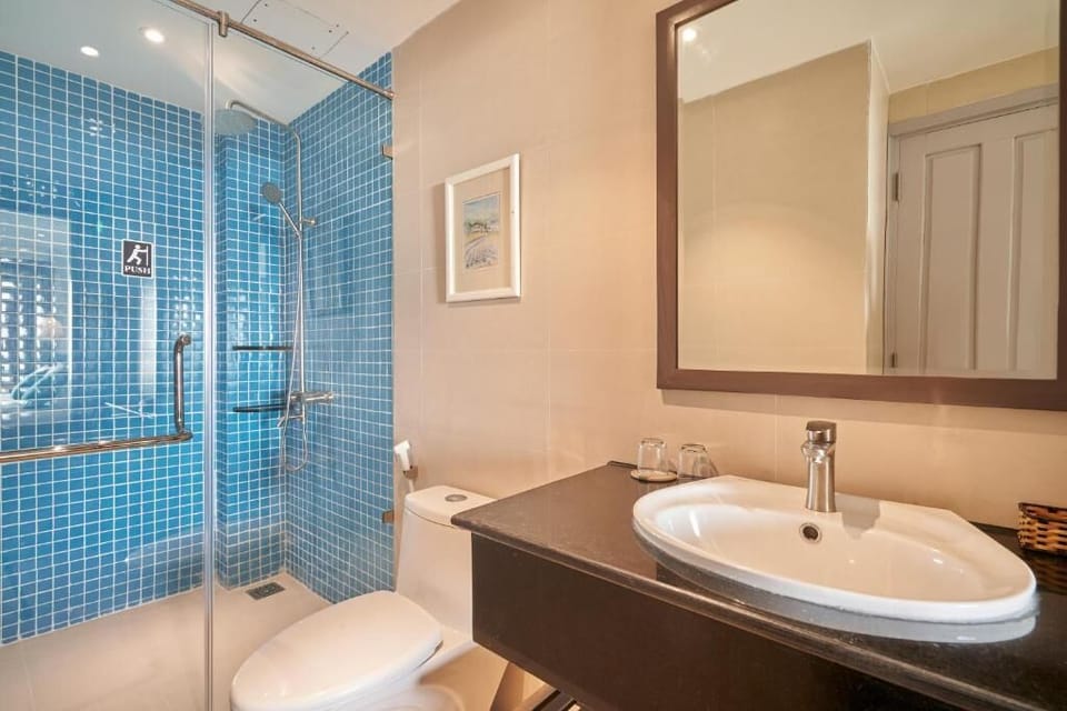 Shower, rainfall showerhead, designer toiletries, hair dryer