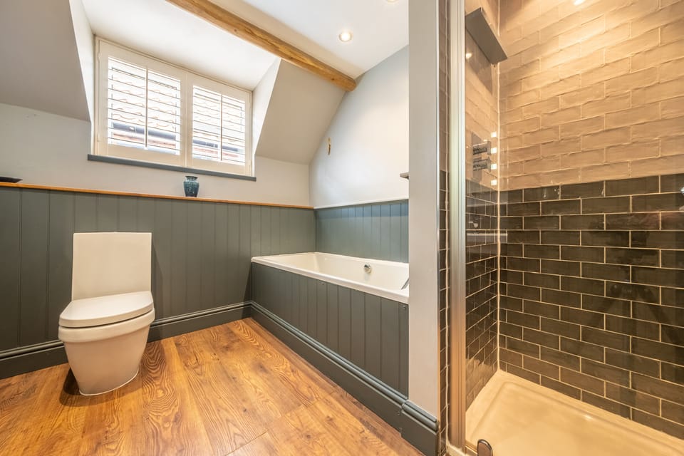 First floor: Family bathroom with separate bath and shower