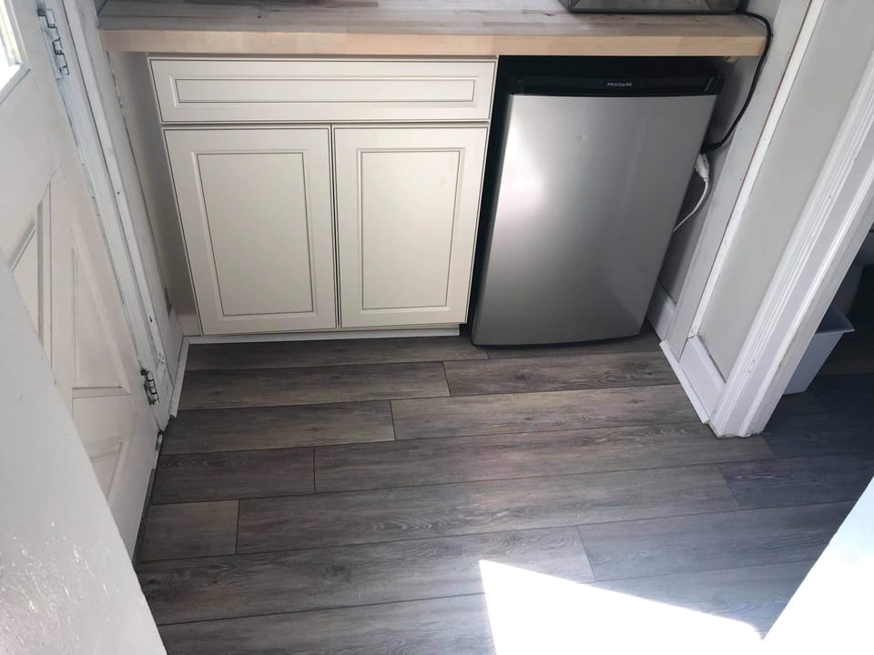 Nook off kitchen with mini fridge