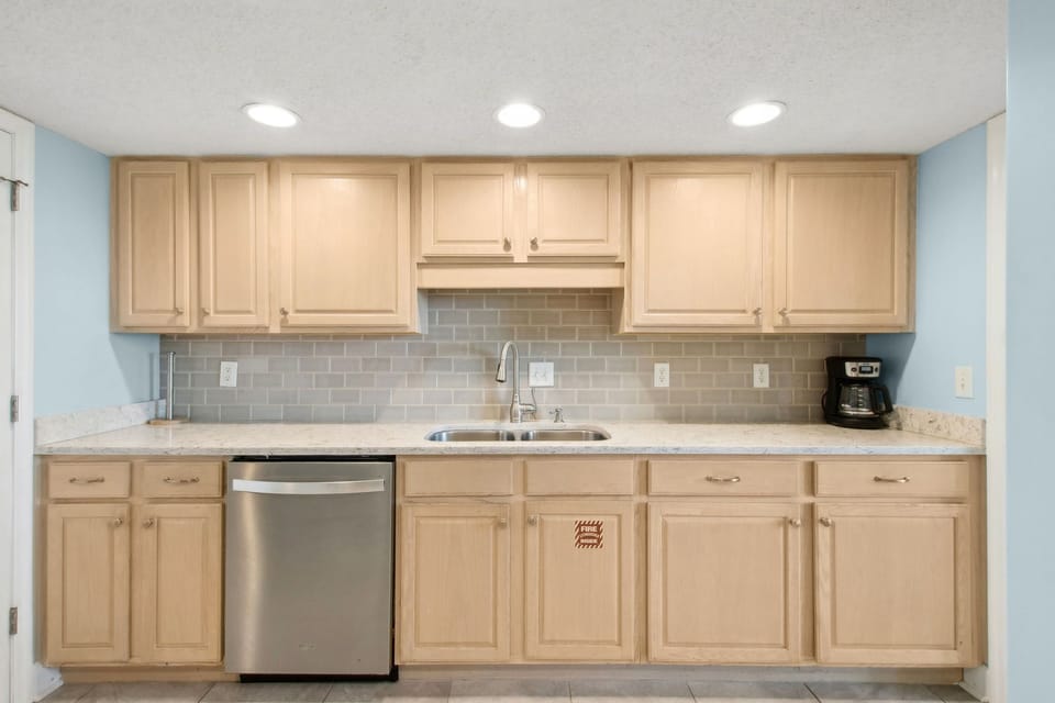 Fully Equipped Kitchen with Granite Counters and Stainless Steel Appliances
