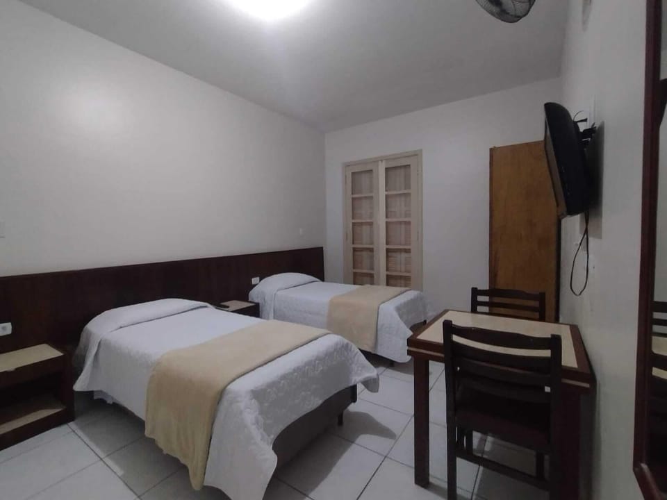 Family Room | Minibar, desk, WiFi (free), bed sheets