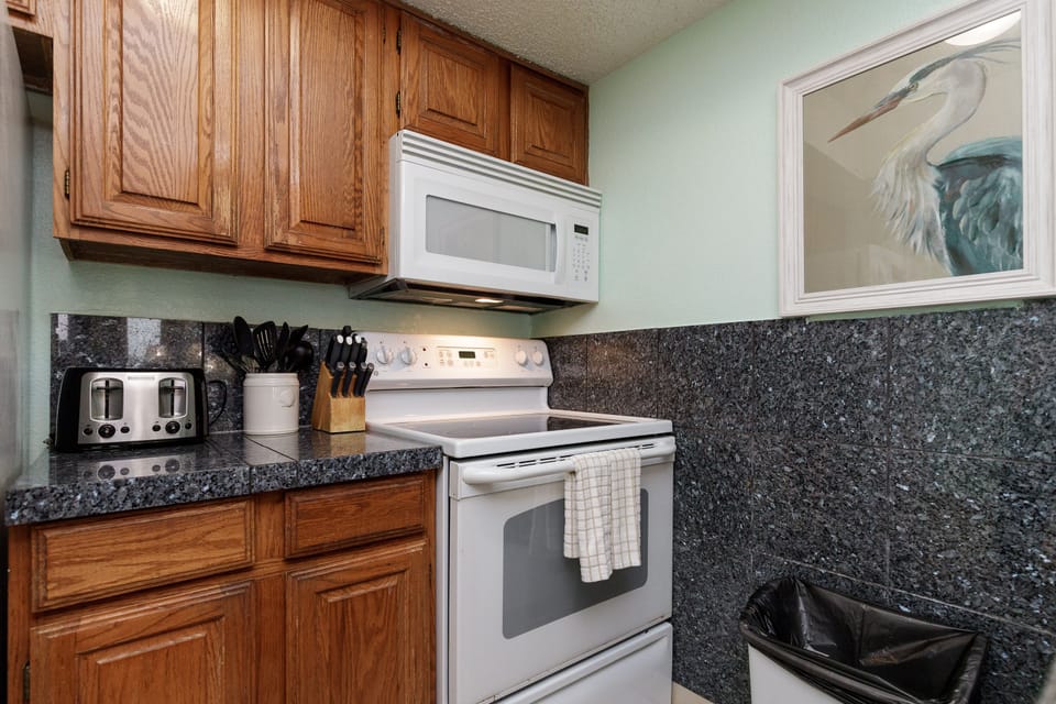 Your fully equipped kitchen features granite counters, oak cabinets, and everything you need to create memorable meals together.