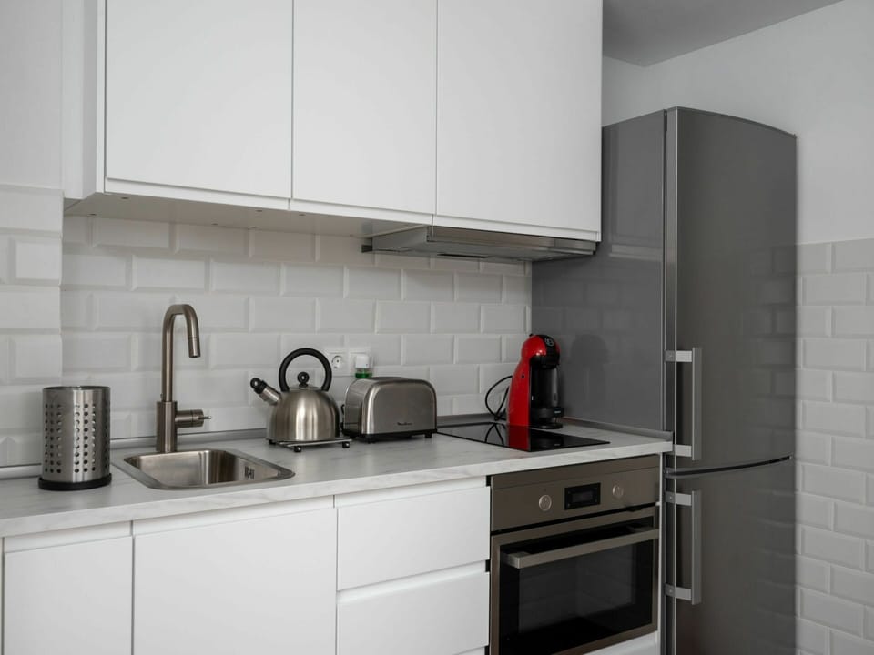 Countertop, Room, Property, Tile, Cabinetry, Kitchen, Furniture, Kitchen Stove, Interior Design, Floor