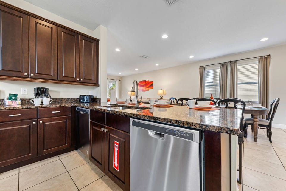 Chic Kitchen of the Home in Kissimmee Florida - Fully Equipped - Plenty of storage space for organized and clutter-free counters - Smart use of space with versatile storage solutions - Thoughtful placement of kitchen essentials for easy access