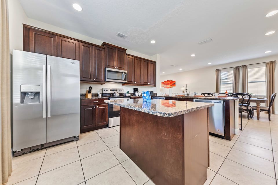 Modern kitchen of the Home in Kissimmee Florida - a space designed for creativity and convenience - Crafting elaborate meals or brewing a simple cup of coffee, every moment is infused with warmth