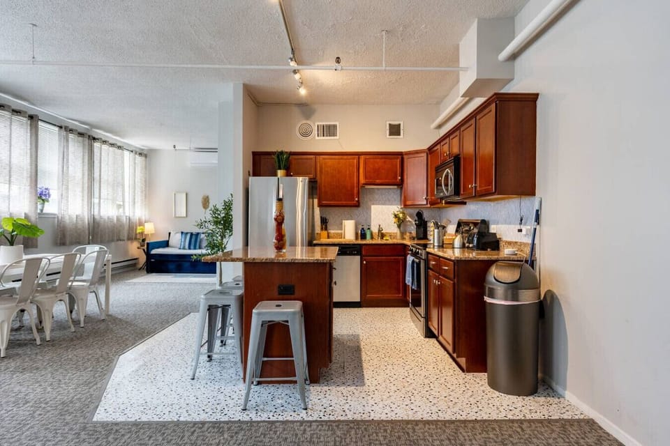 A fully equipped kitchen with ample counter space, perfect for brewing morning coffee and enjoying the convenience of home-cooked meals.