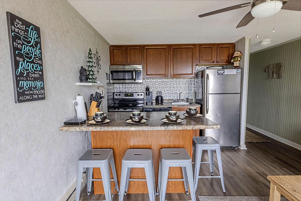 ​The island seats four and makes a perfect spot to gather for meals!